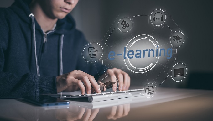 university student reads a cybersecurity online textbook